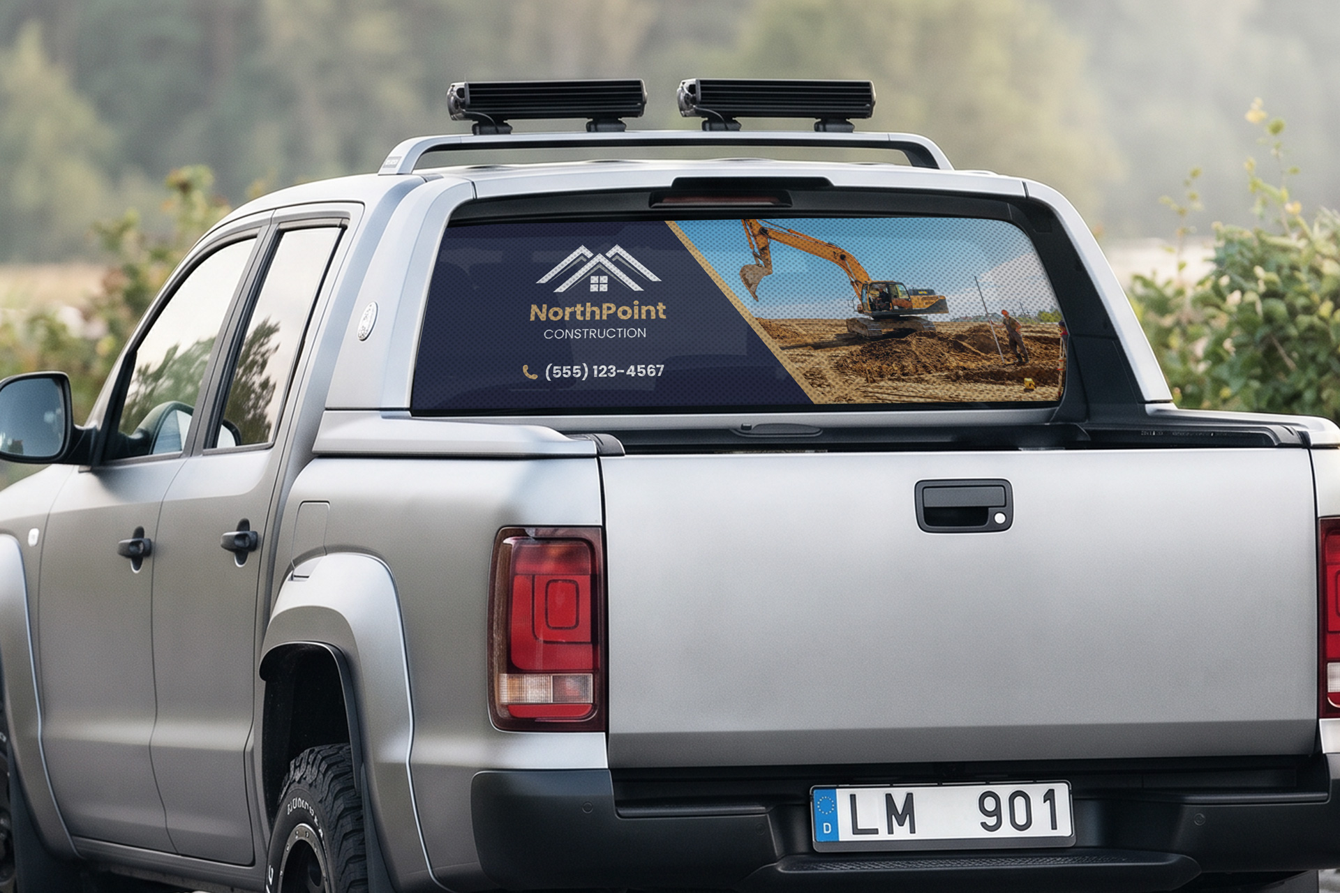 Perforated car window decal applied to the rear window of a pickup truck