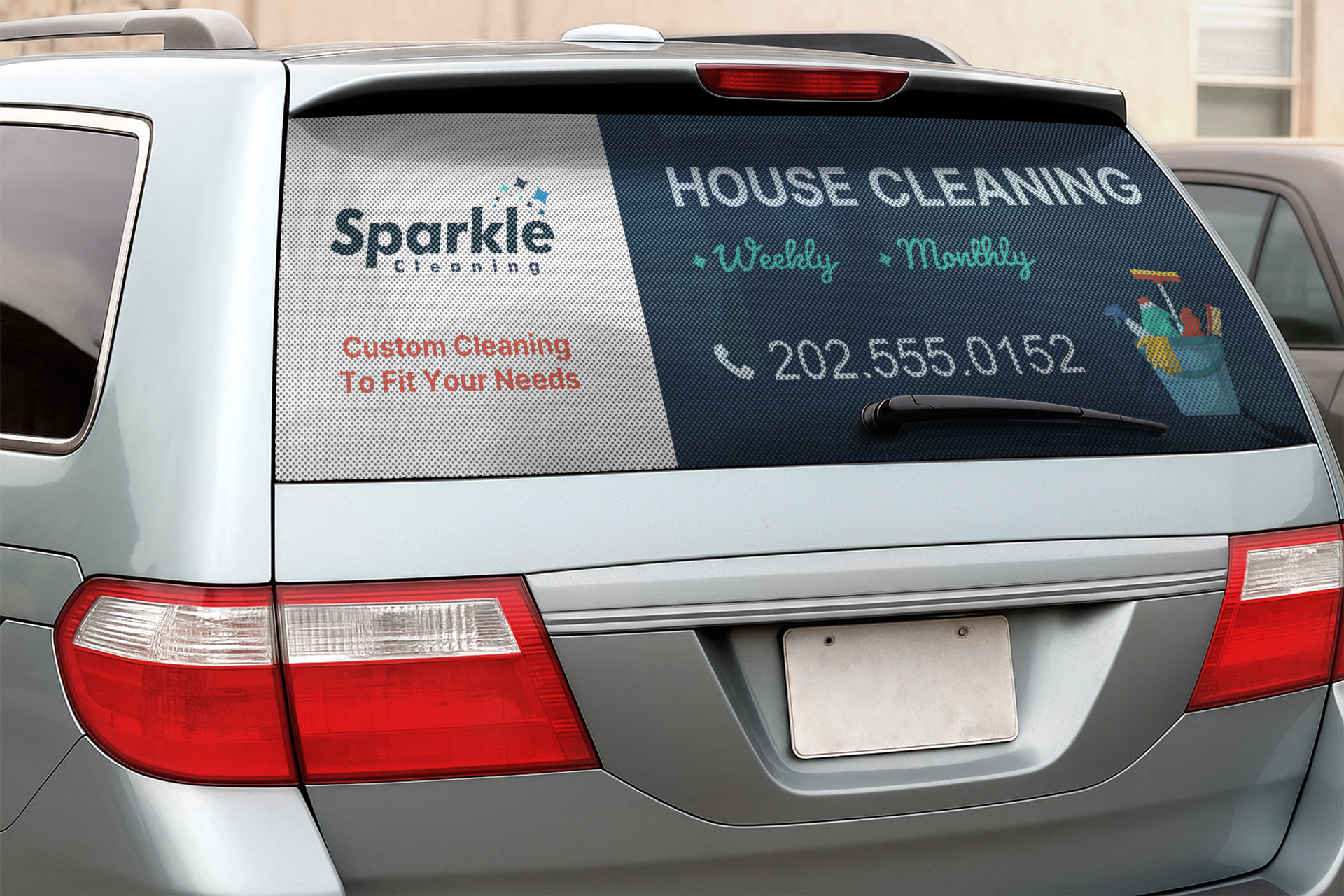 A marketing perforated decal displayed on the rear window of a vehicle.
