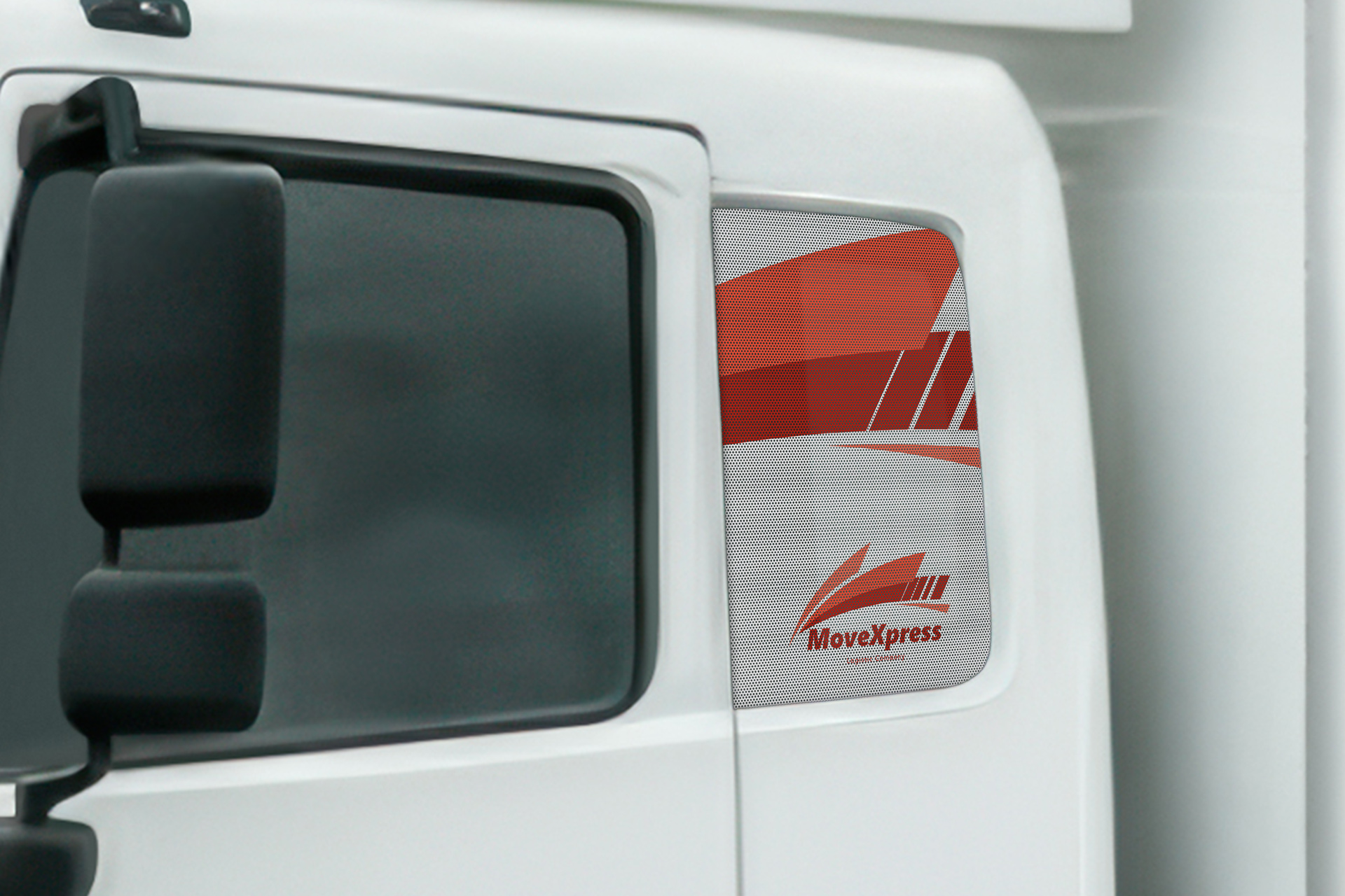 Perforated trailer decal installed on a side window.