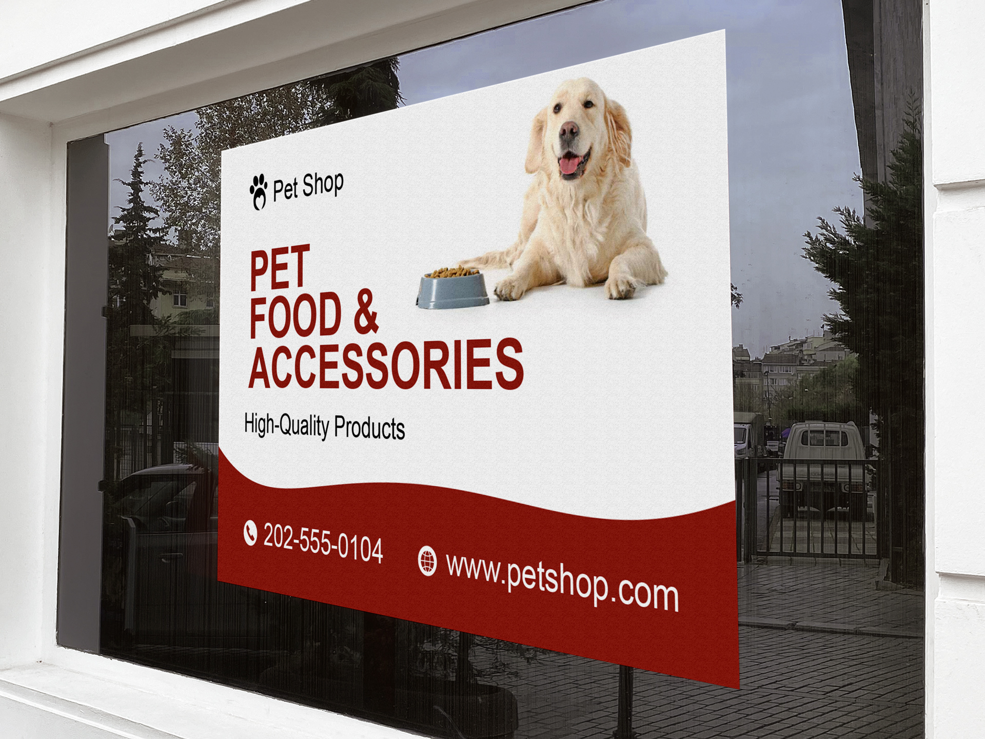 Pet shop window signage with company website and contact information.