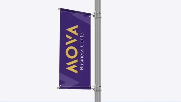 Vertical pole banner reading MOVA Business Center on a purple background with gold text.