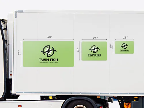 Vehicle magnets shown attached to the side of a trailer to comare the different sizes of the product.