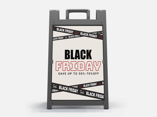 Black Friday A-frame sign with caution tape design and a promotional message.