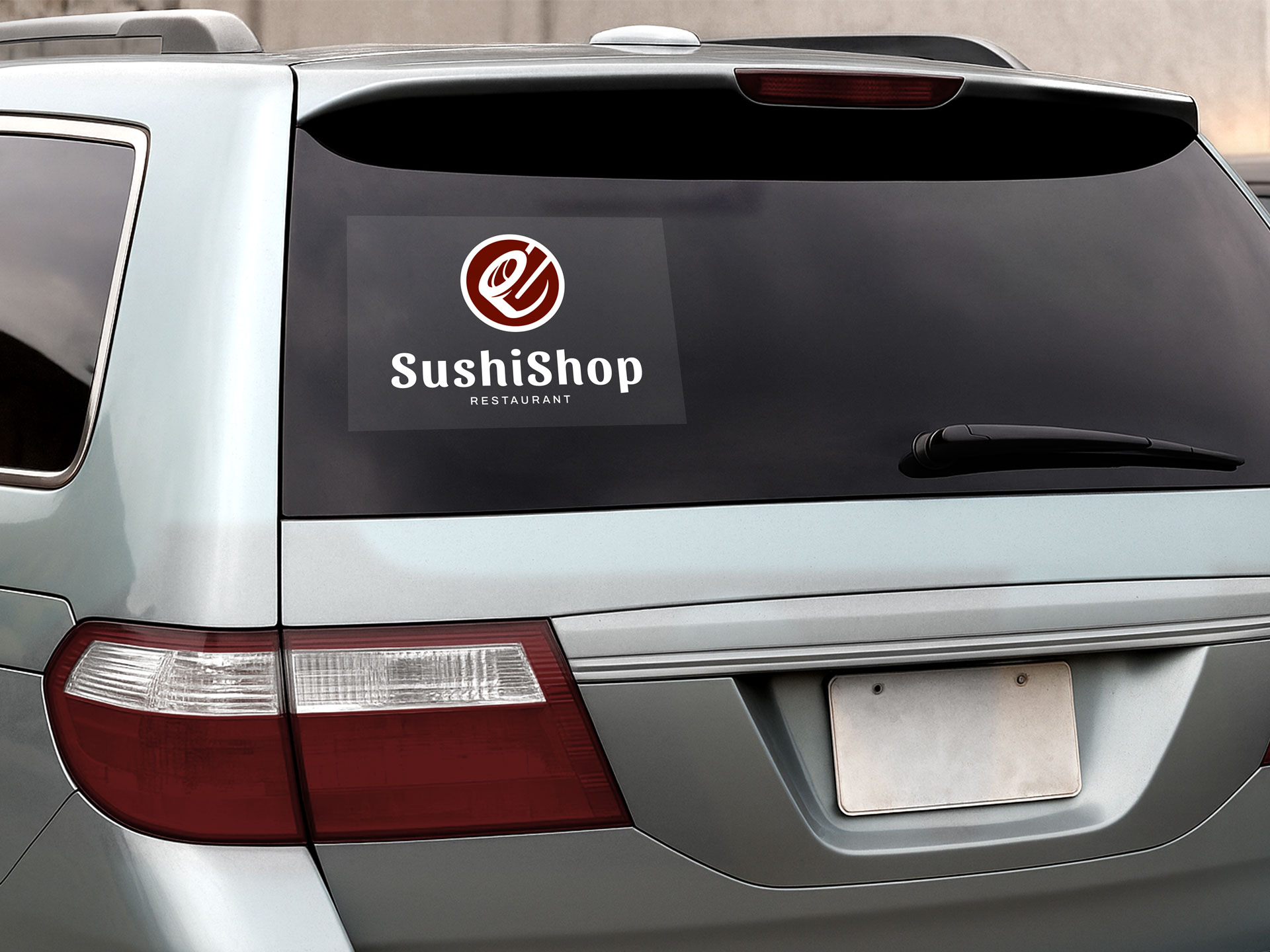 clear window decal installed on a car with sushi shop promotion