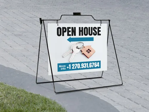Directional real estate sign guiding visitors to a property's open house