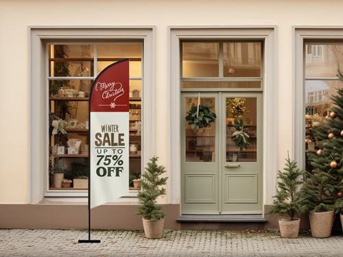 Outdoor red and white feather flag with “Winter Sale Up to 75% Off” text in front of a Christmas-decorated storefront.