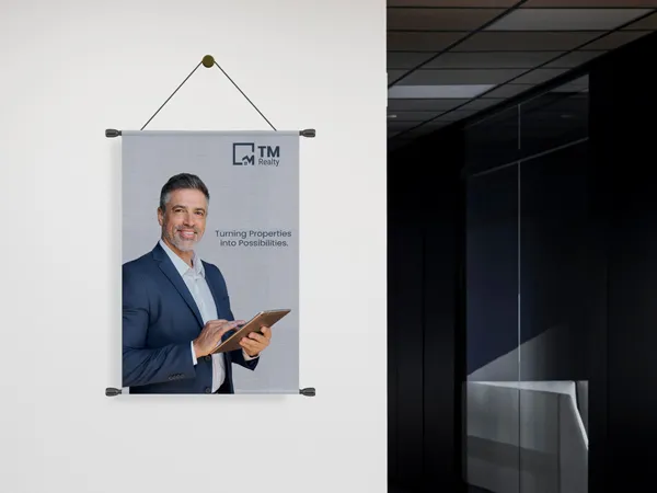 Professional rolled canvas prints showing smiling man in suit.