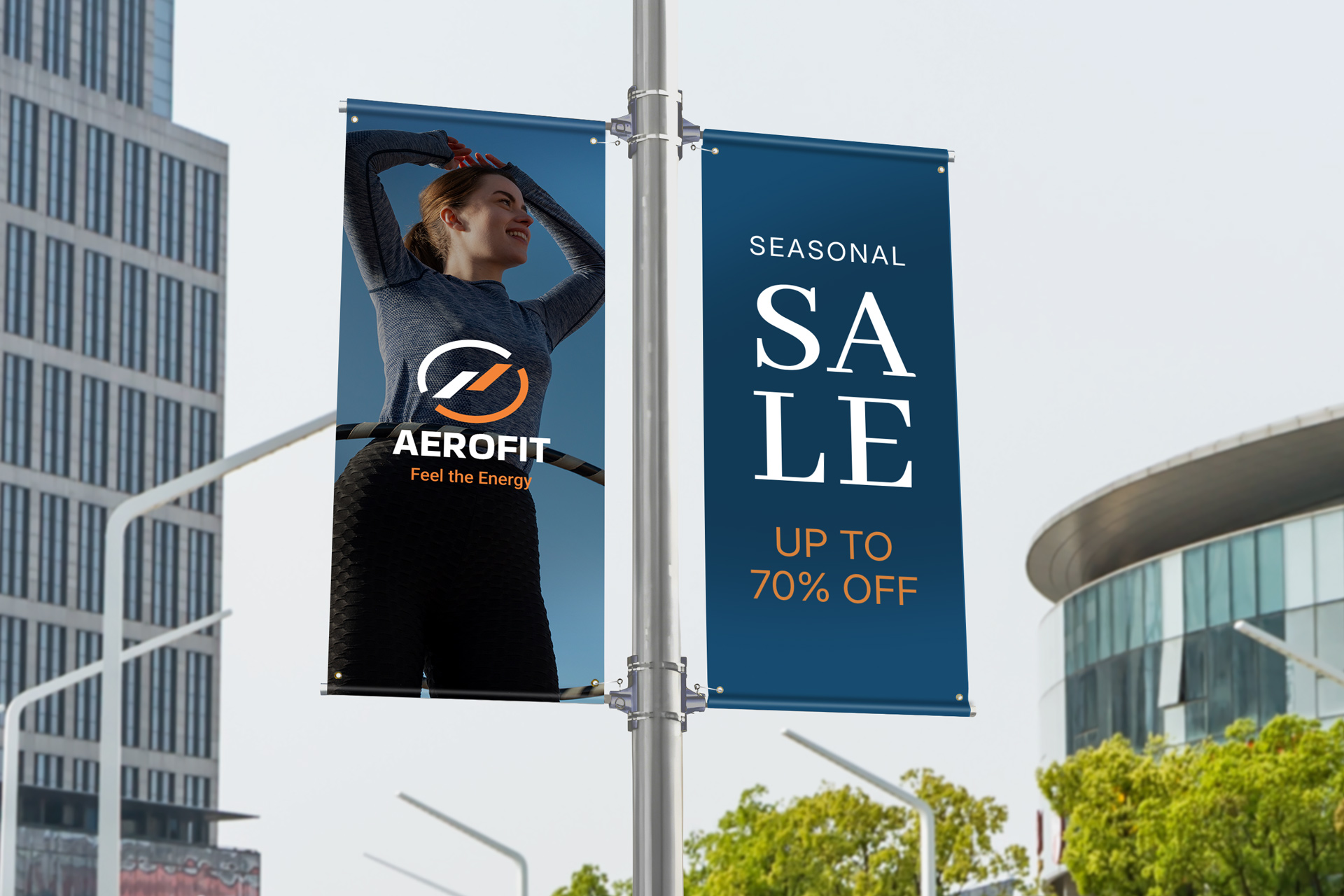 Two pole banners mounted on a street pole displaying a seasonal sale promotion