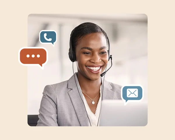 A customer support agent surrounded by icons of a chat application, a phone, and an email letter.