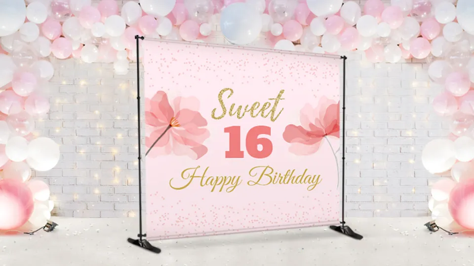 A Sweet 16 Happy Birthday backdrop with floral design in light pink.