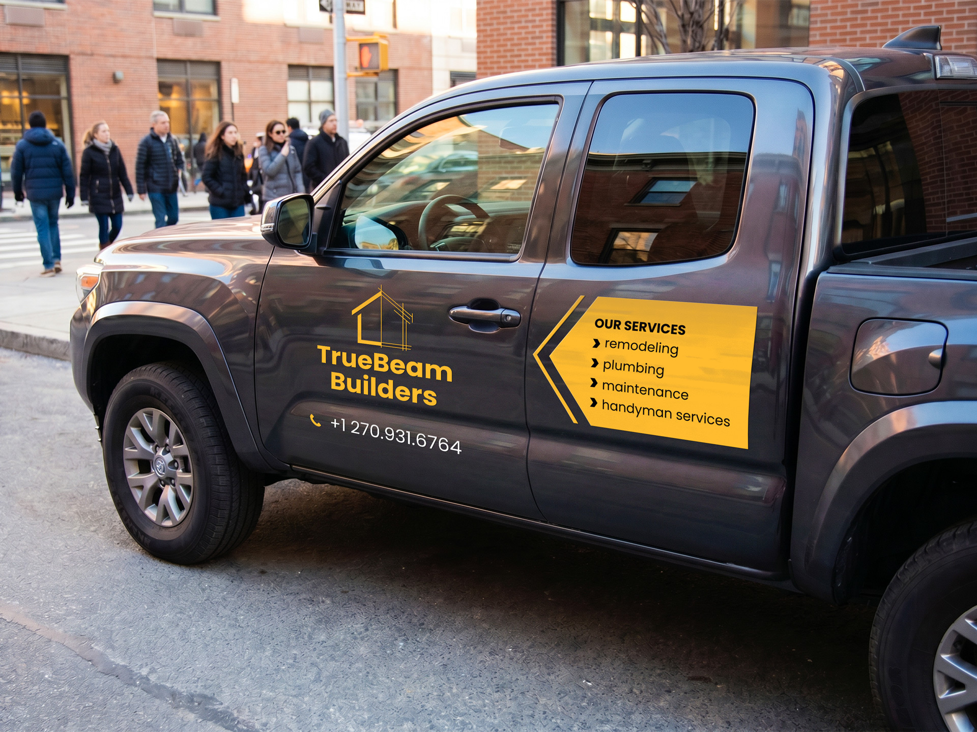 Yellow truck decal listing the property maintenance services