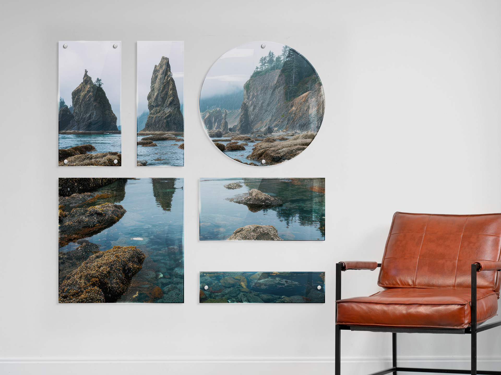 Custom acrylic prints in various shapes displaying coastal photography on an office wall