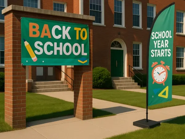 Custom vinyl banner and other displays at a school entrance for a back to school celebration