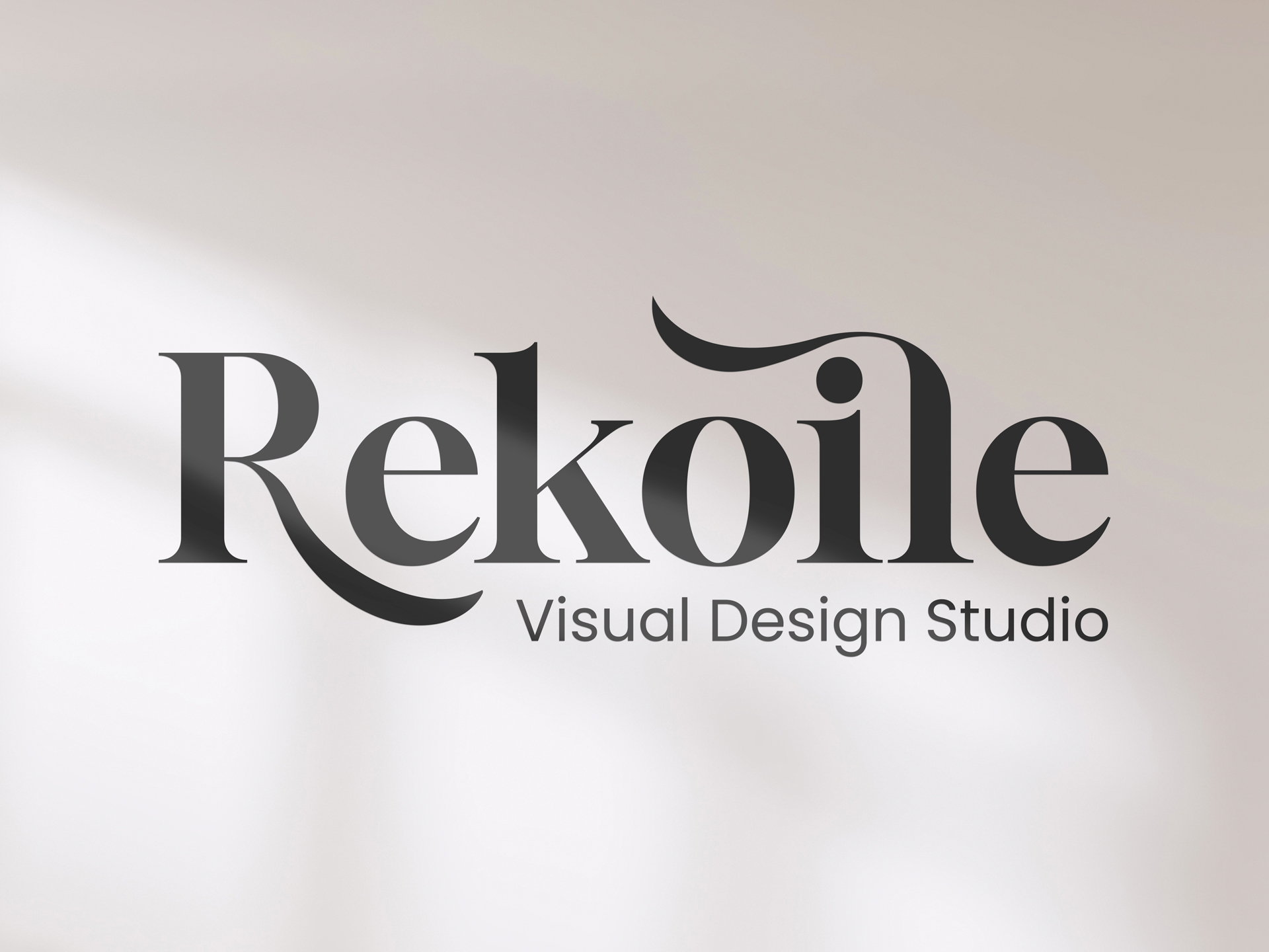 Vinyl wall lettering for interior branding featuring the text Rekoile Design Studio
