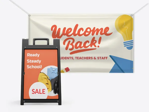 An image showcasing back to school signs including a sandwich board and a hanging banner.