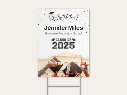 Graduation signage with confetti accents and group cap toss image below class text