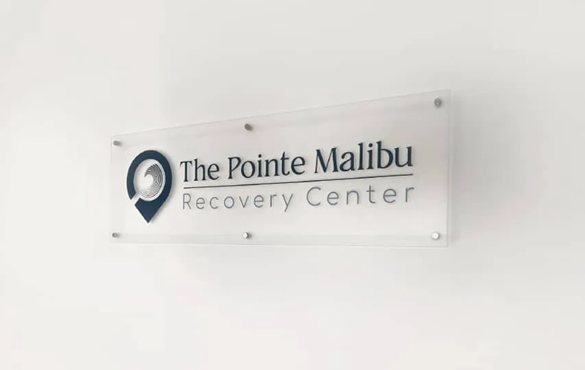 A frosted acrylic plaque with a recovery center's logo and name.