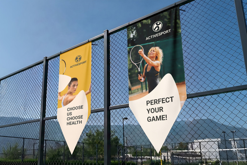 Two sports pennant banners on fence