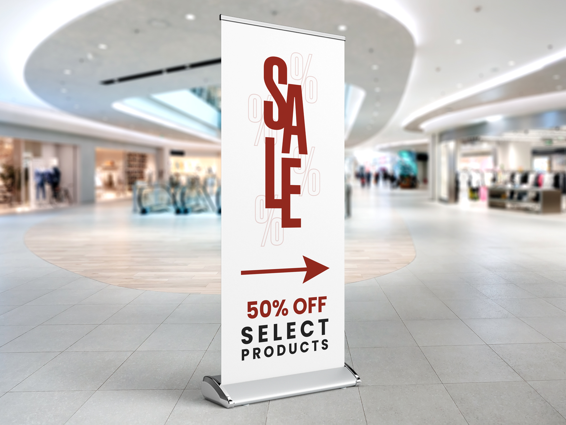 Roll up banner installed in a shopping mall showcasing sales information.