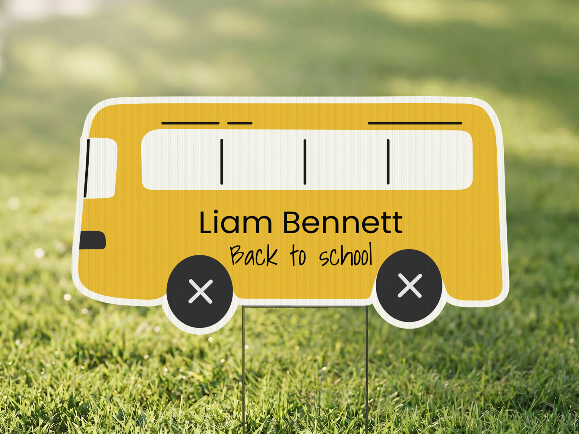 Bus-shaped yard sign for the first day of school.