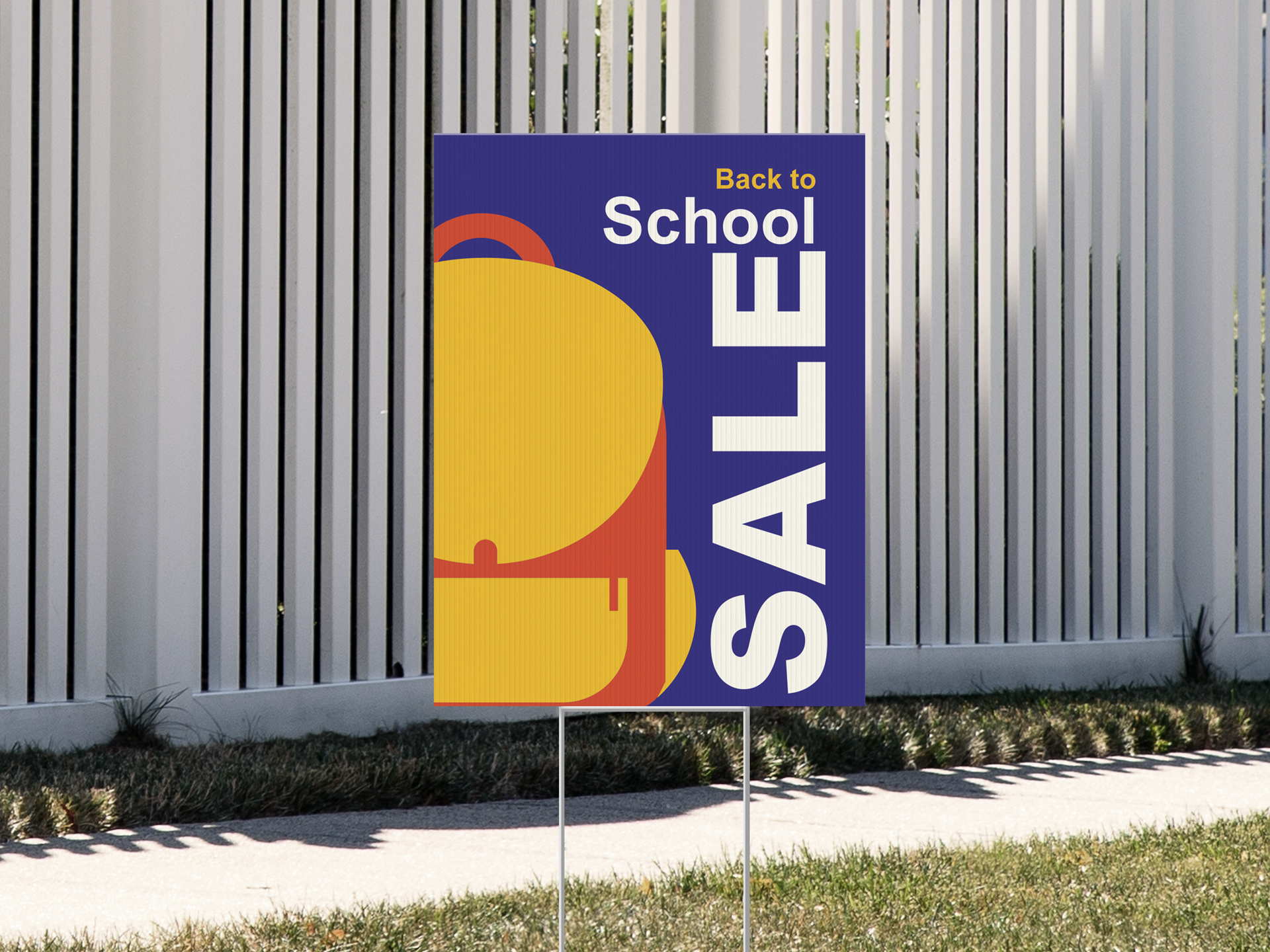Yard sign advertising back to school sales.