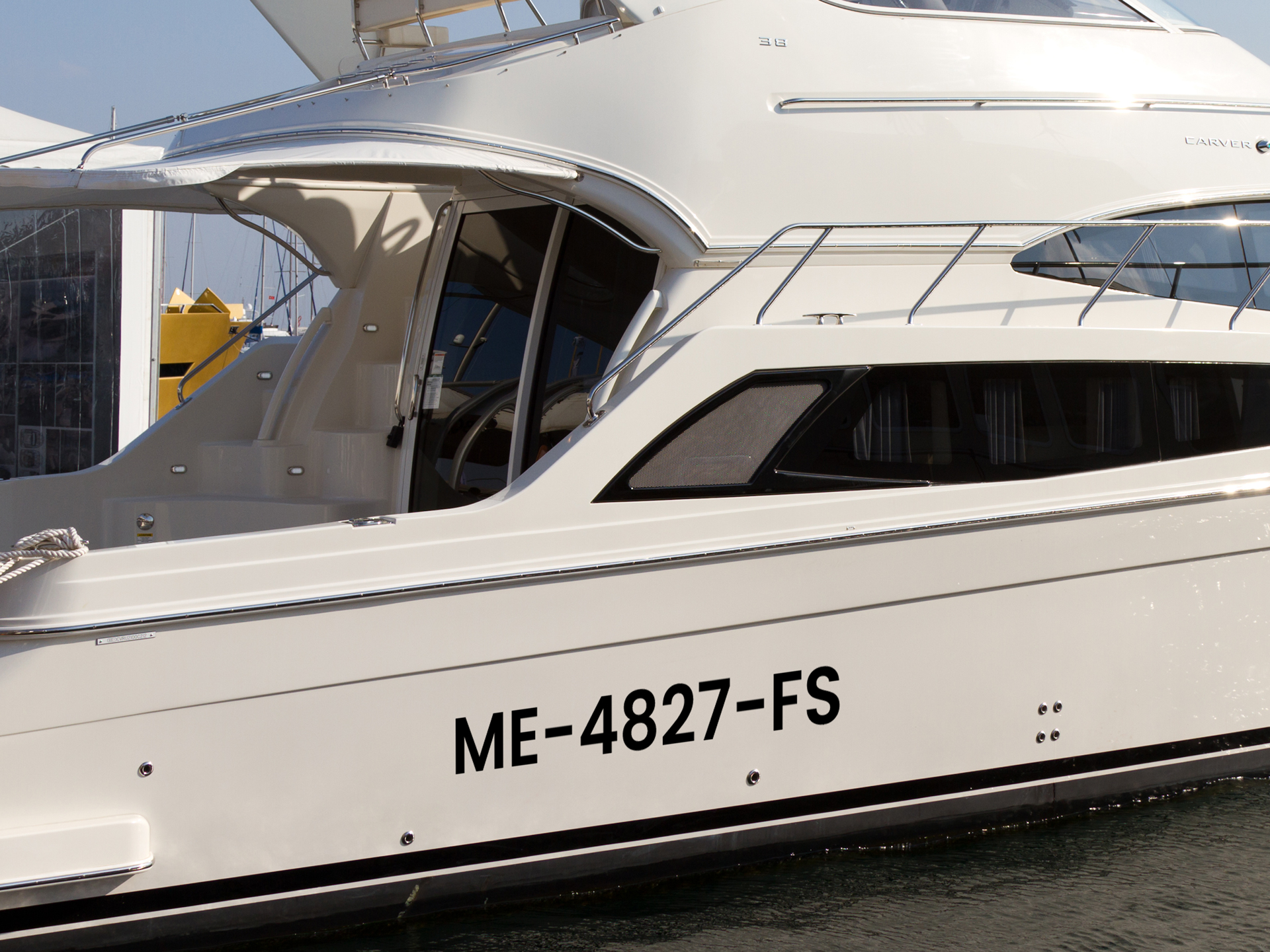 Black vinyl boat registration number decal applied to the hull.