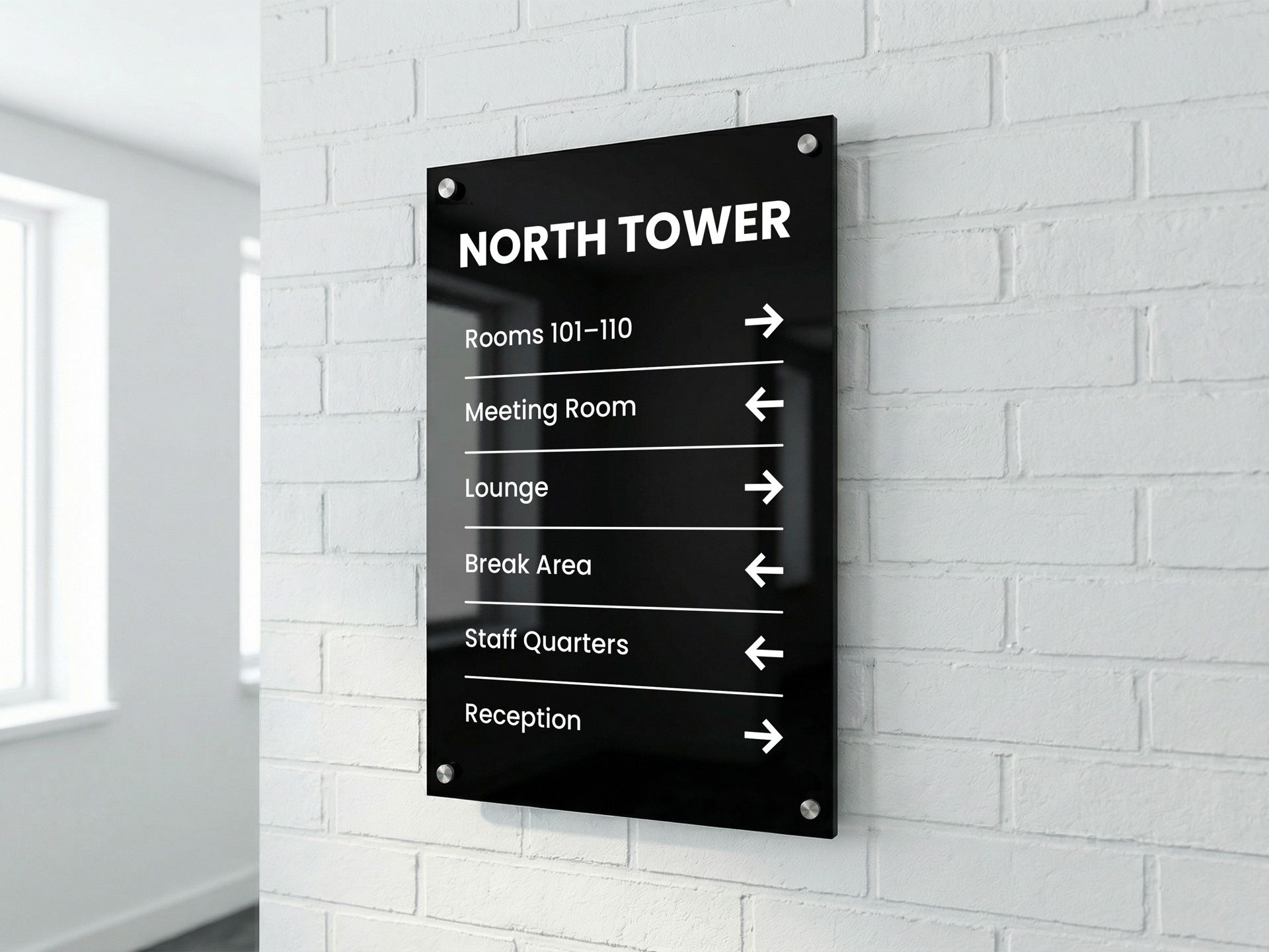 black-acrylic-office-directional-signage-mounted-on-a-brick-wall