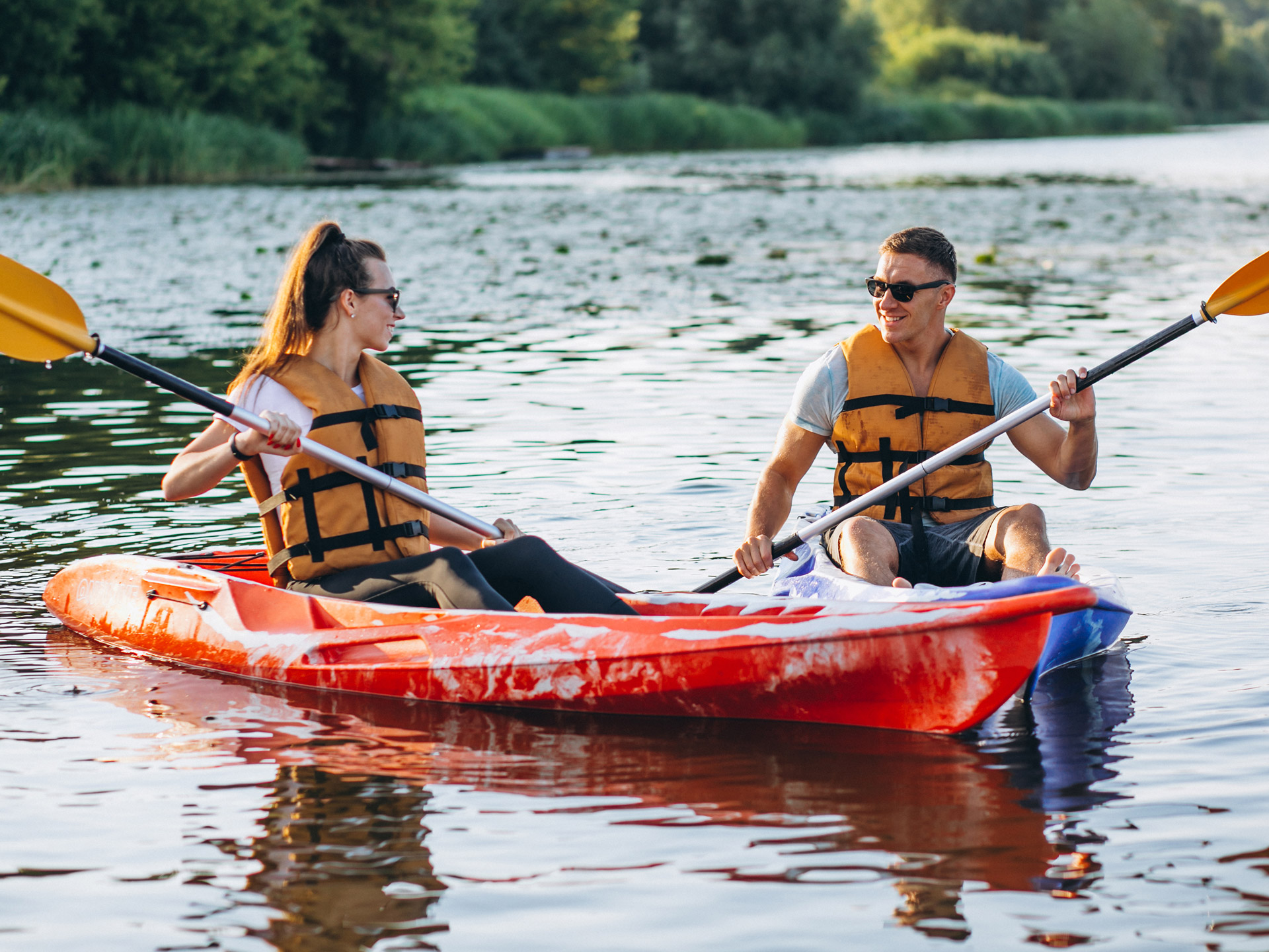 couple-kayaking-on-a-lake