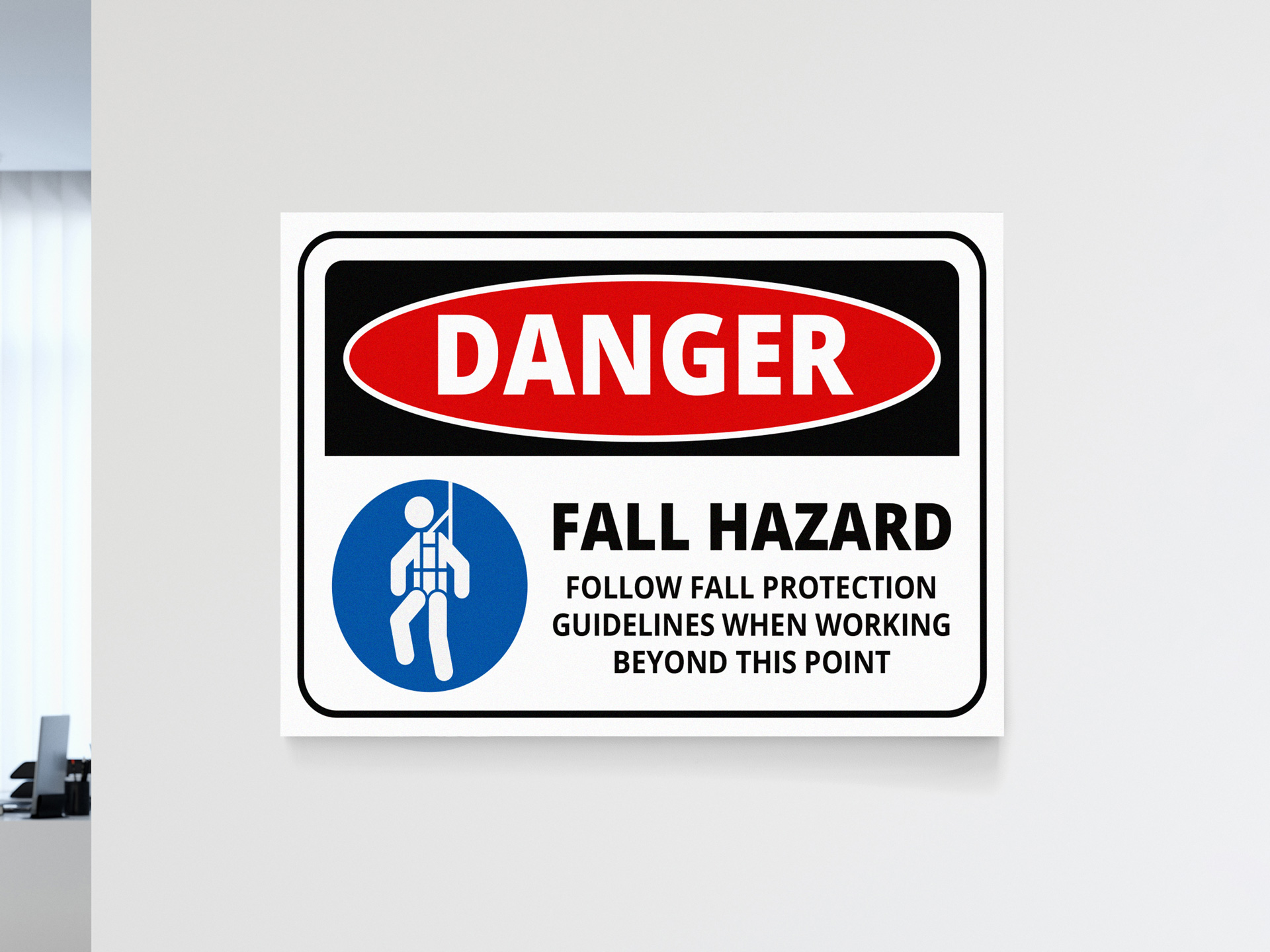 Danger sign for fall hazard requiring fall protection equipment.