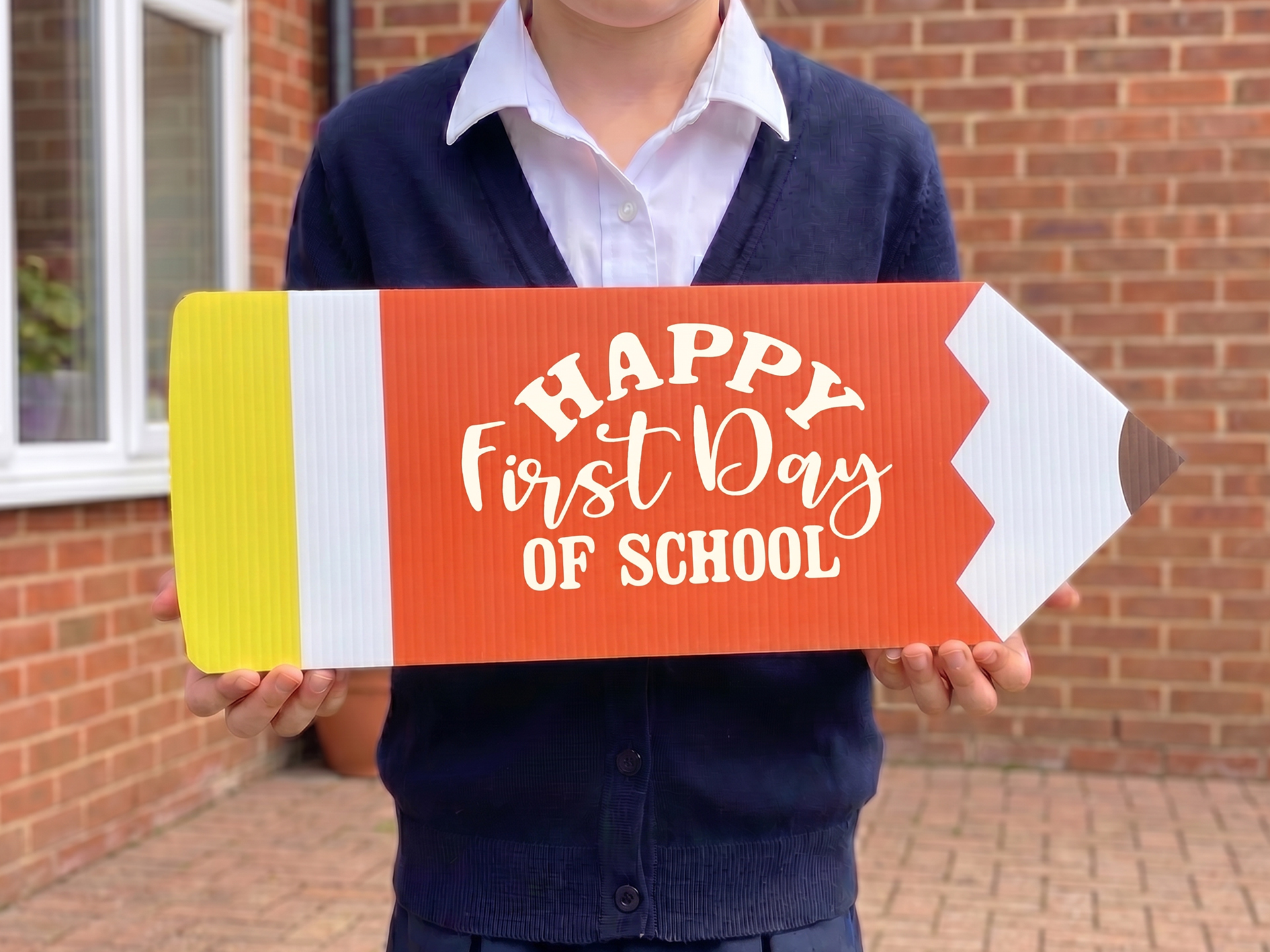 Personalized Coroplast sign in a pencil shape for first day if school.