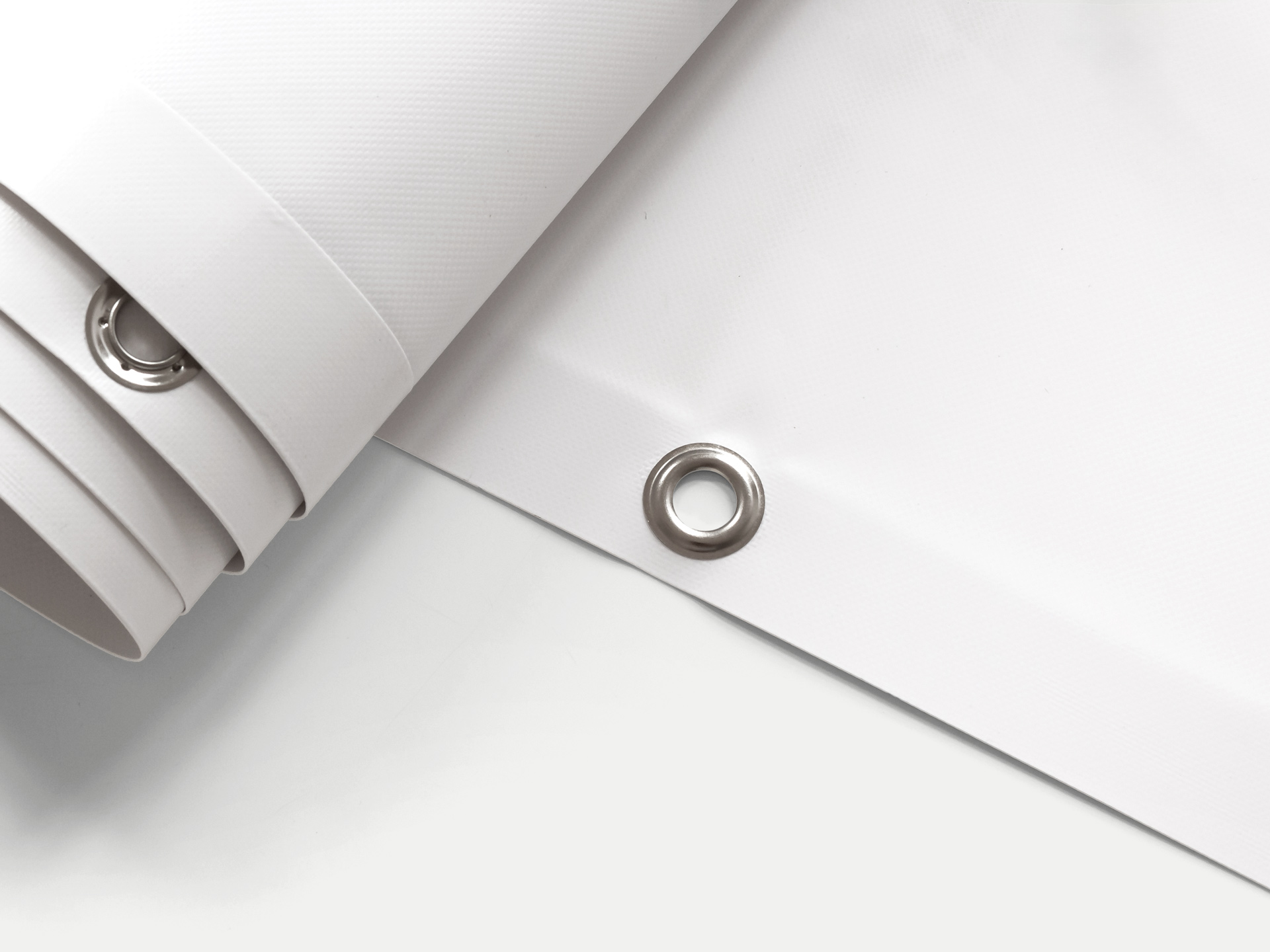 white banner with reinforced metal grommets