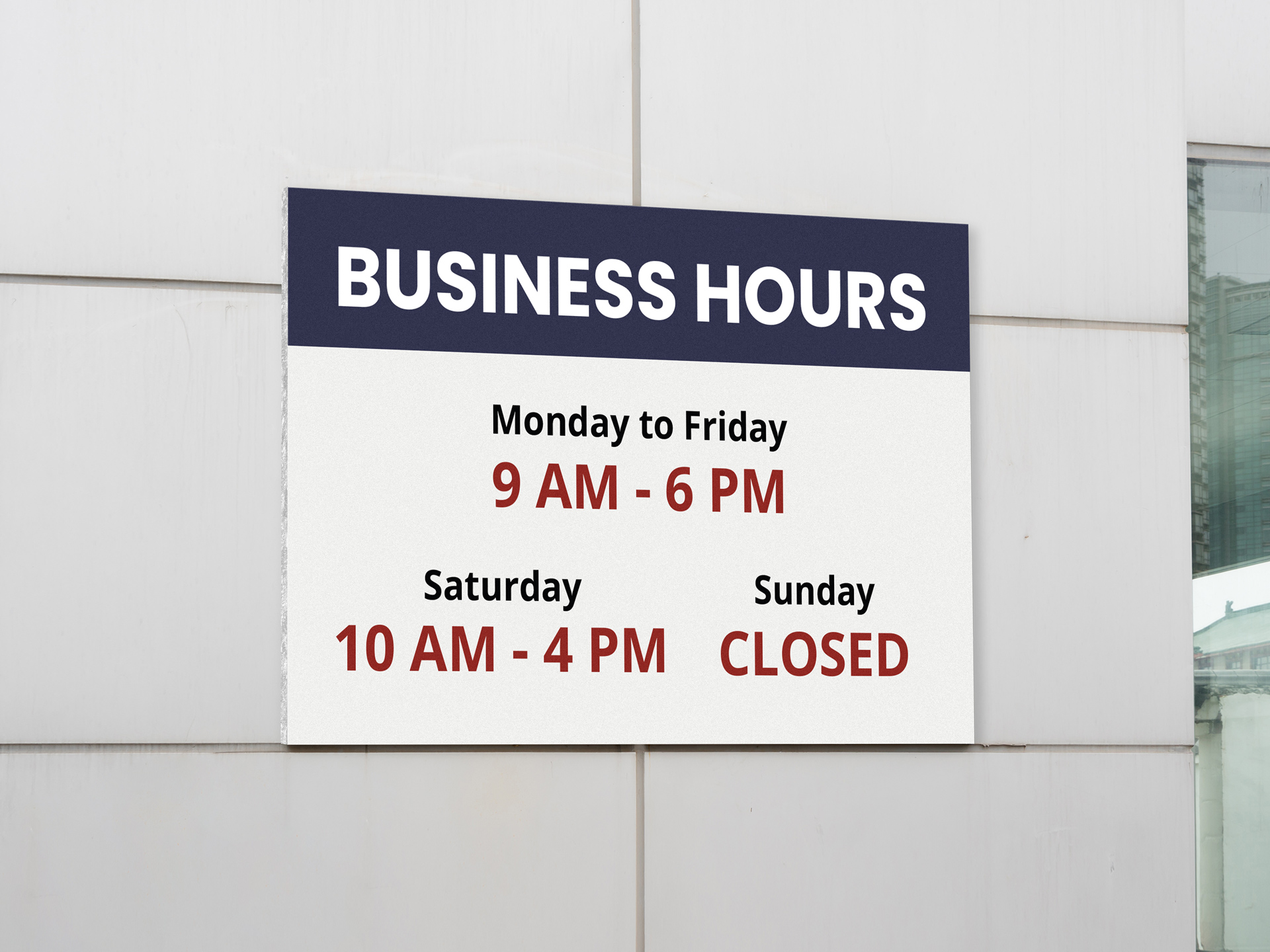 Business hours foam board signage mounted on a wall.