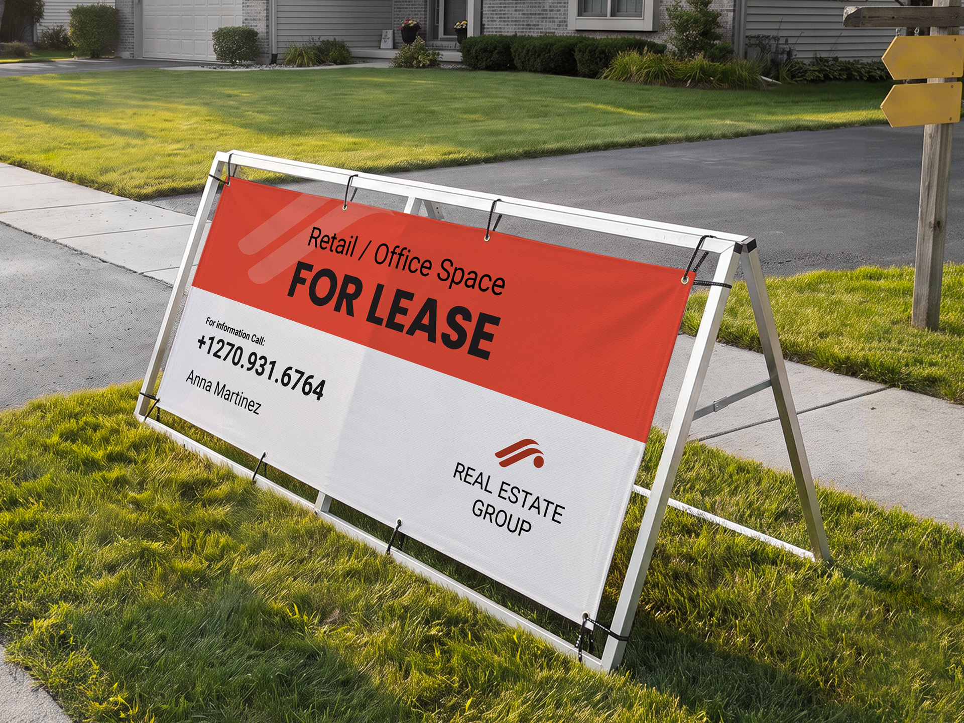 A frame banner advertising retail and office space for lease on a street.