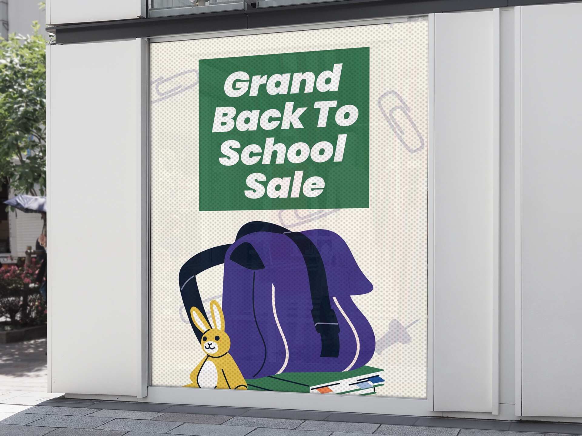 Perforated window decal announcing back to school sales.