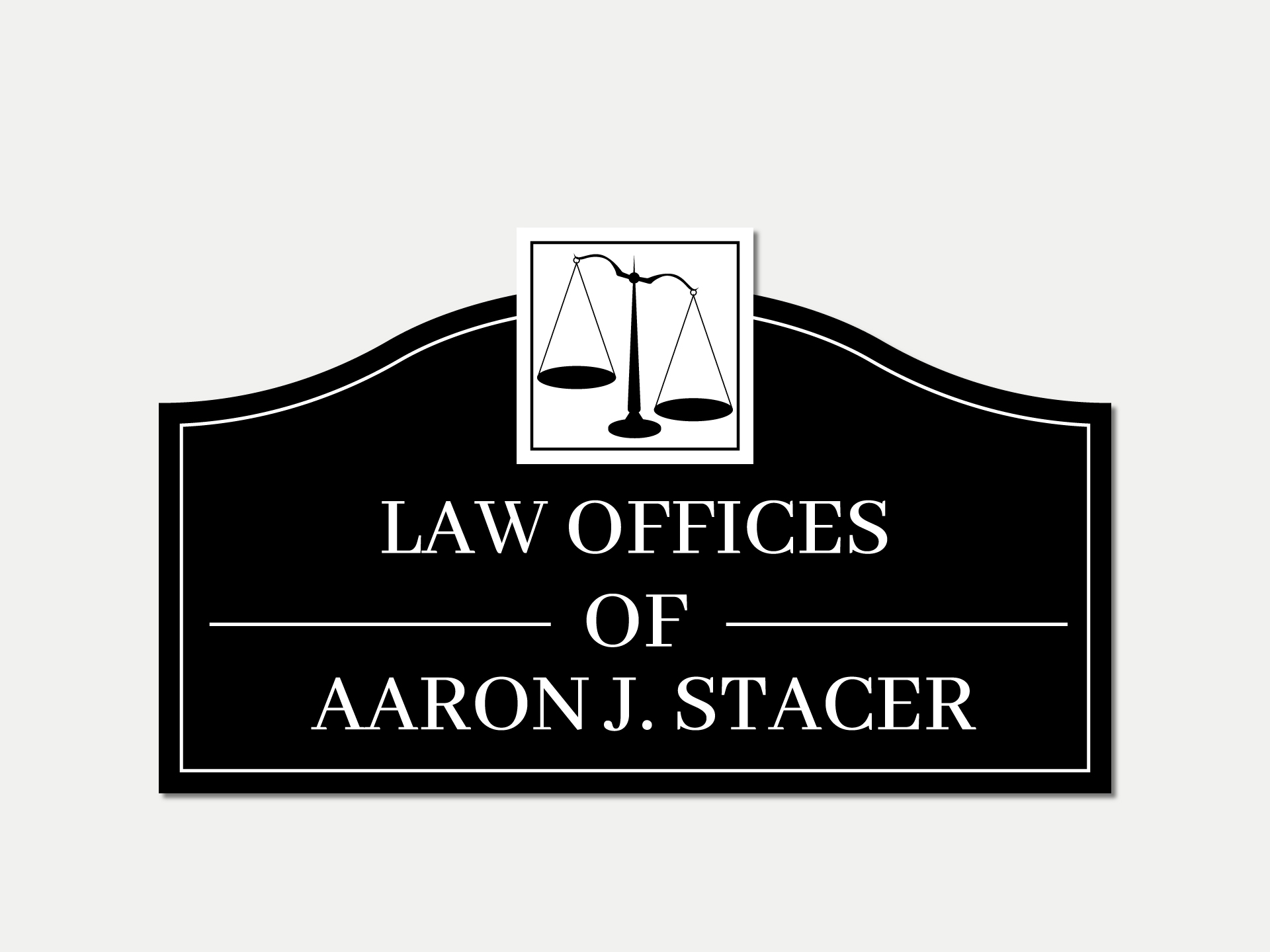 Law office metal signage displaying the firm name and details.