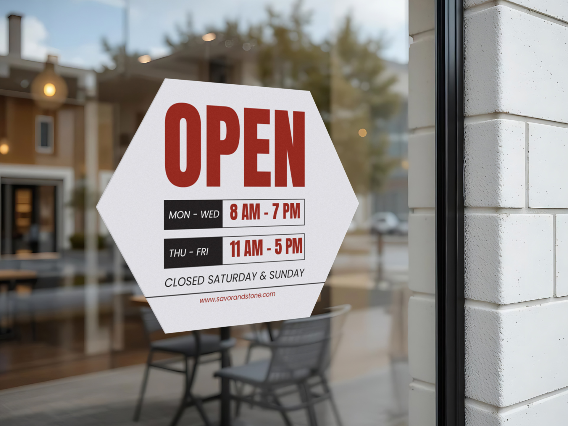 Hexagonal open hours decal on storefront glass.
