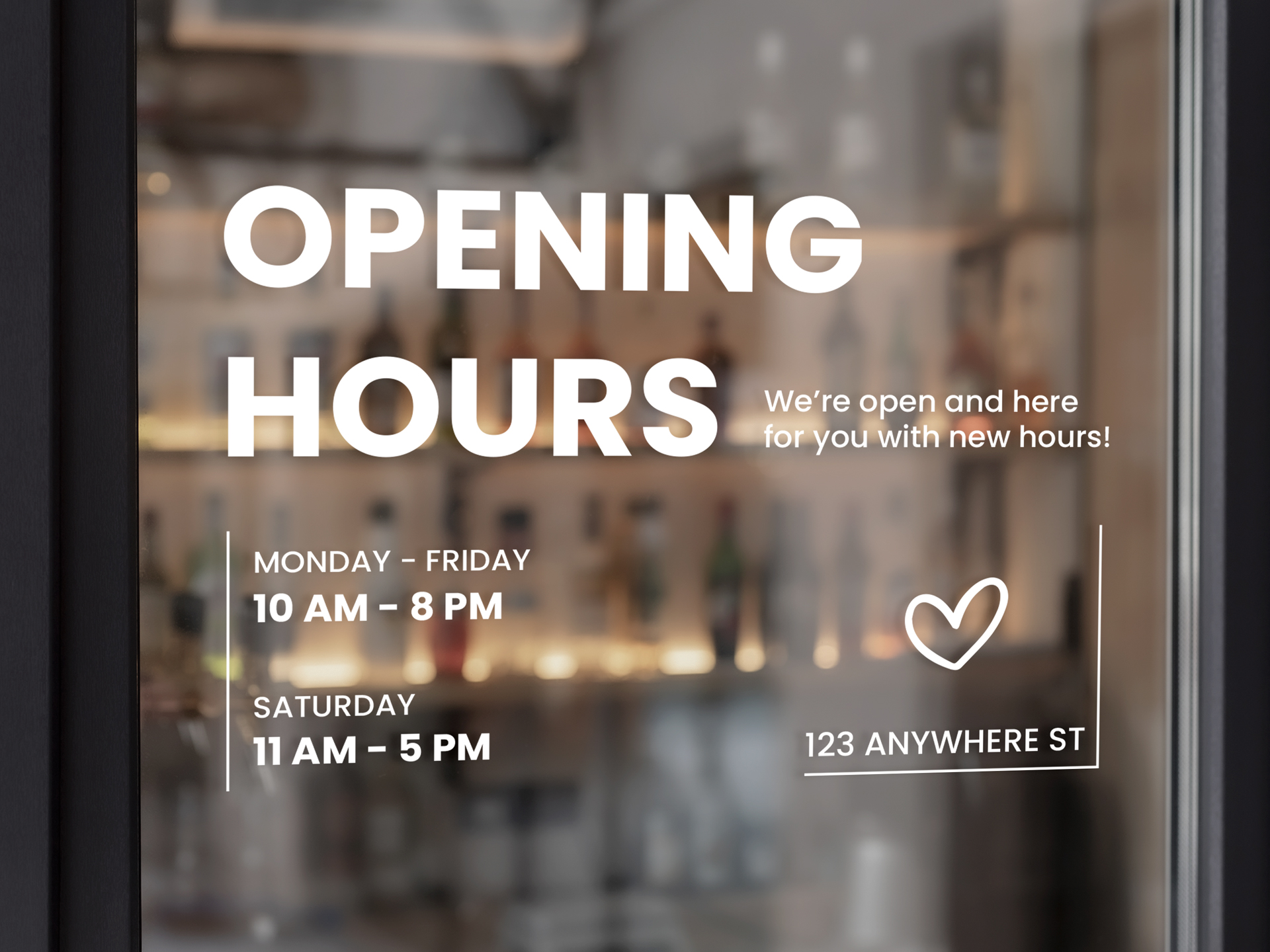 Opening hours vinyl lettering applied to a bar window.