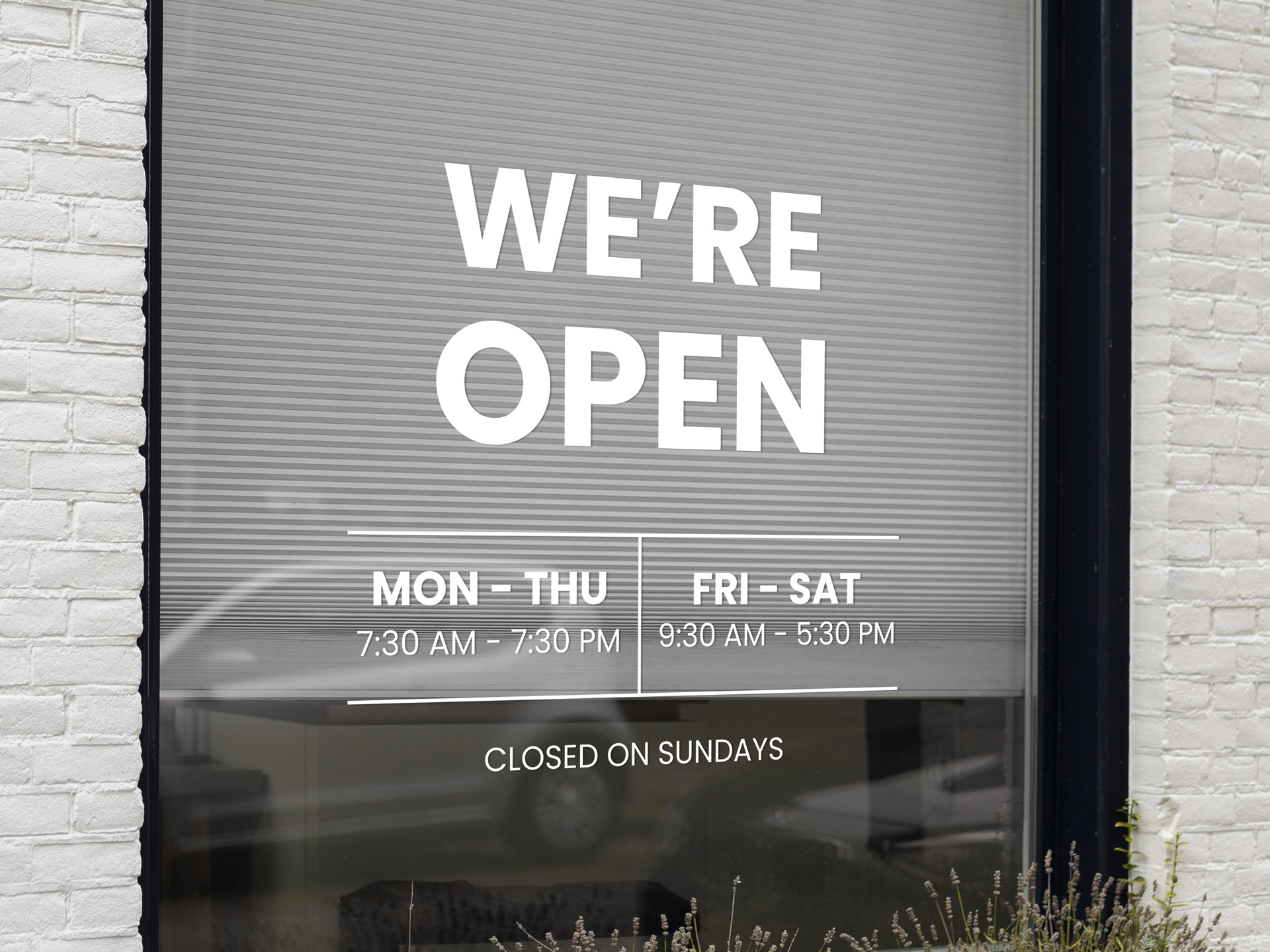 Hours of operation window lettering.
