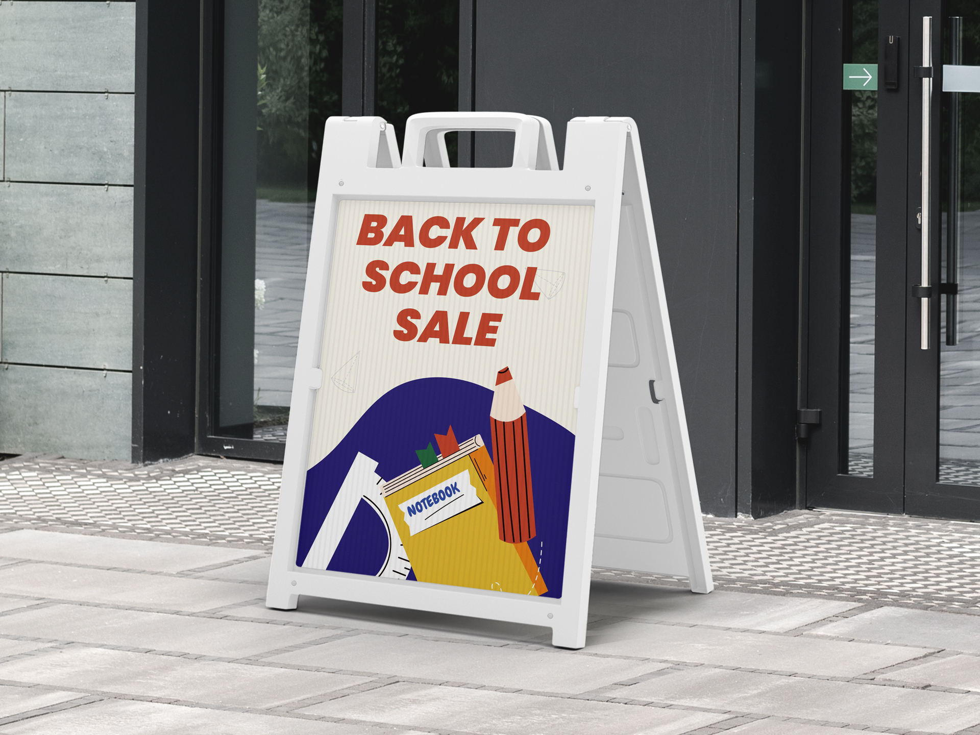 Outdoor a-frame sign advertising back to school season sales.