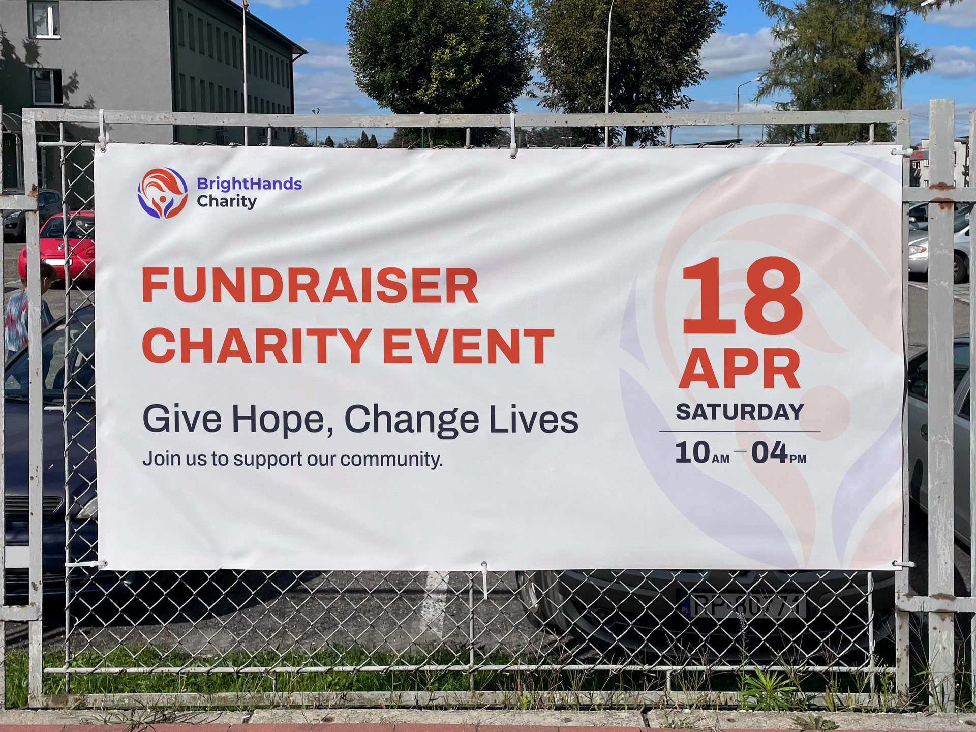 Custom vinyl sign installed on a fence with an event information.