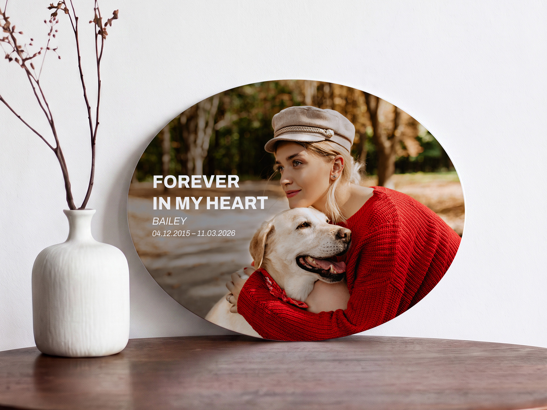 Oval metal photo print featuring an image of a girl and her dog.