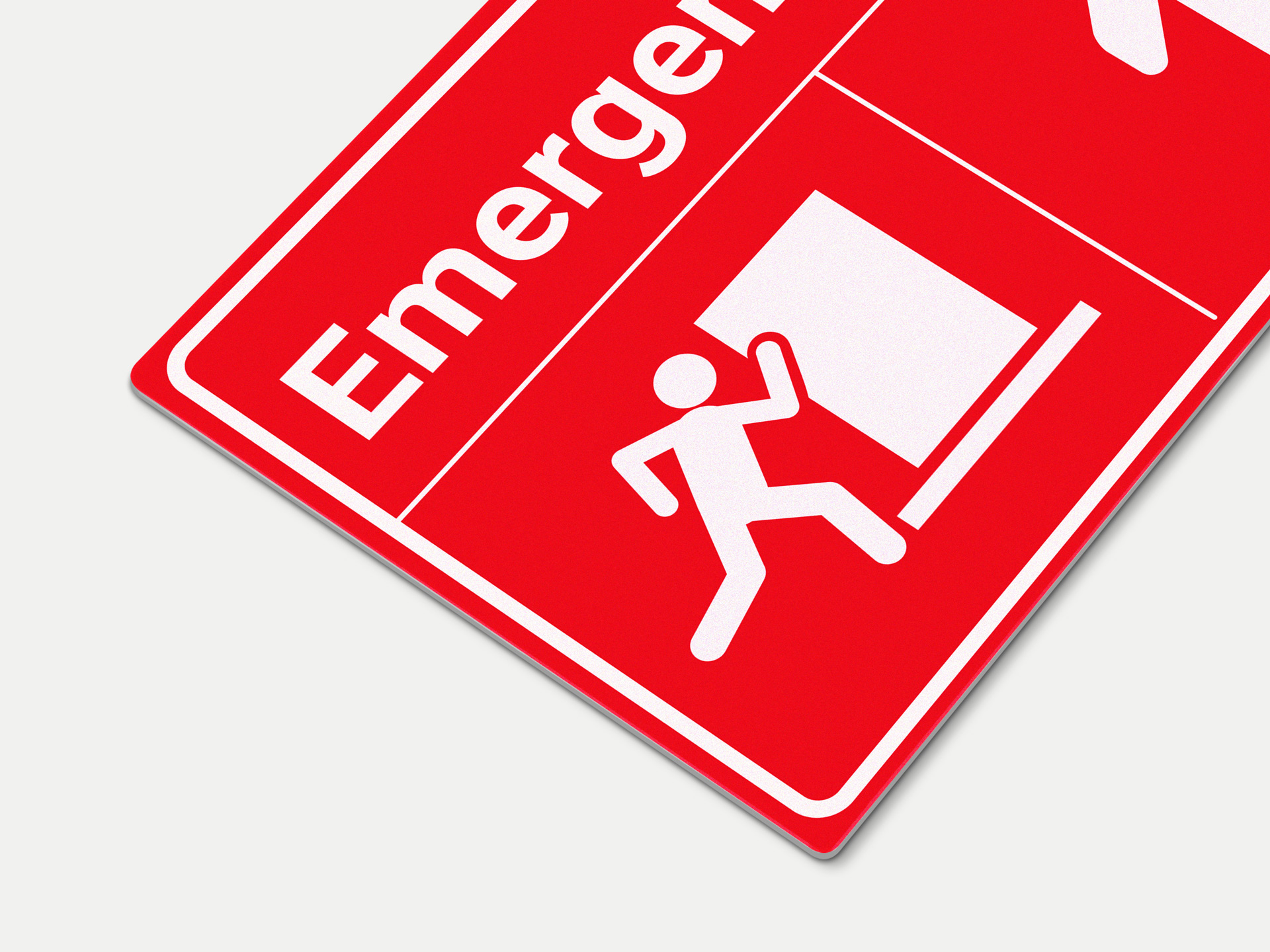 Red reflective aluminum sign showcasing emergency exit.
