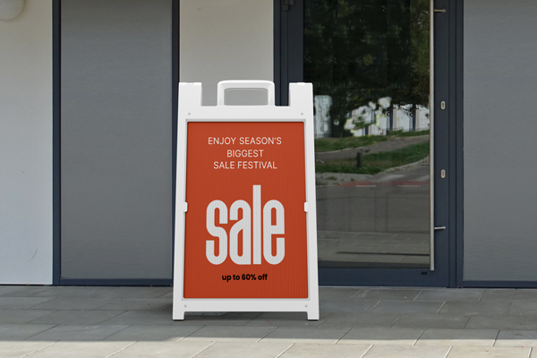 Enjoy Season's Biggest Sale Festival retail sandwich board displaying a promotional message.