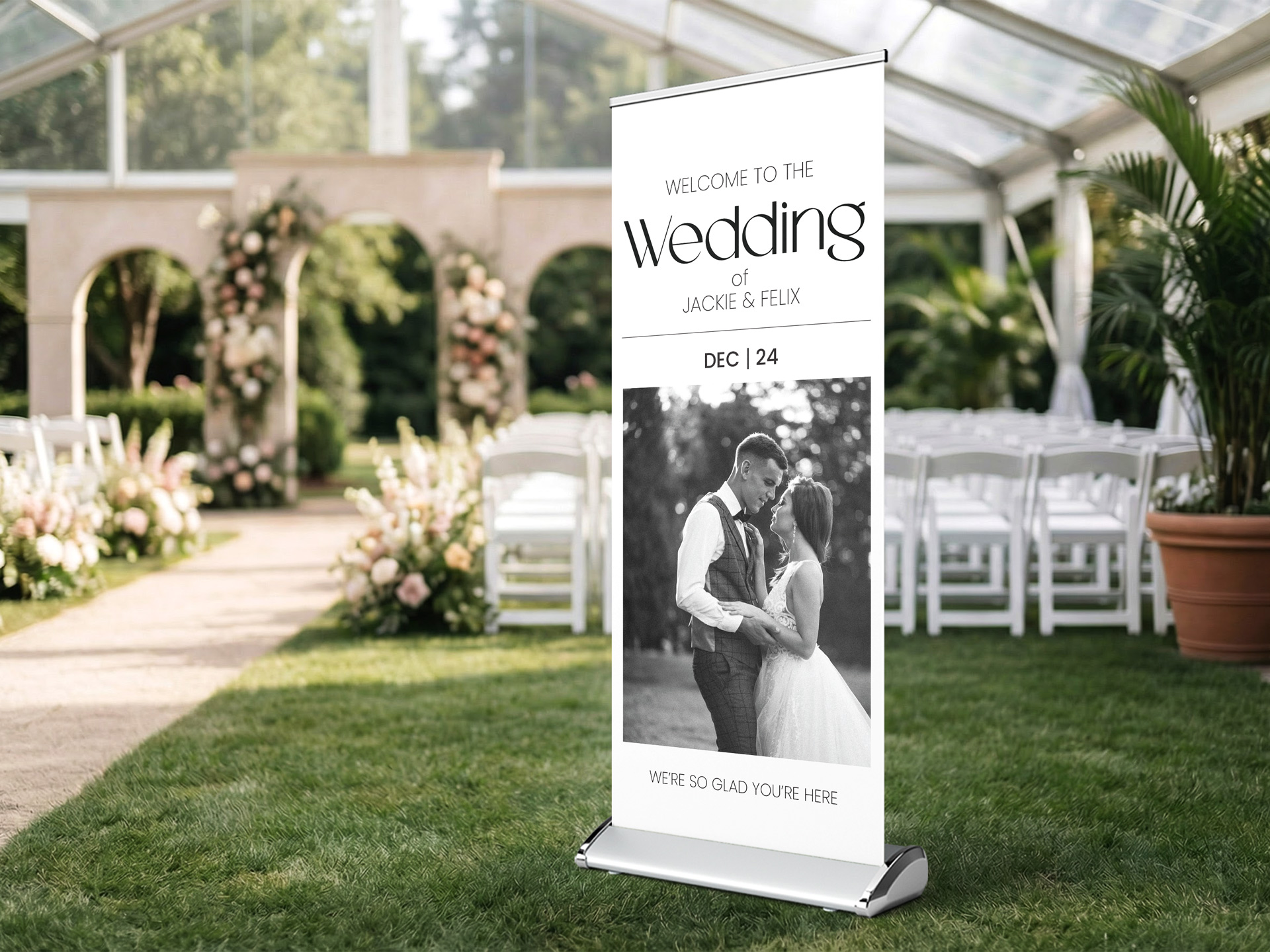 Retractable wedding banner with couple photo at garden venue