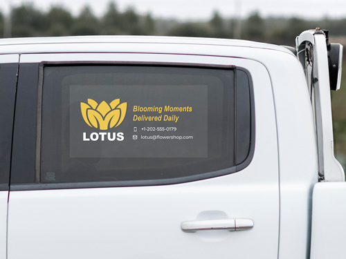 Truck window decal for branding displaying company's logo and contact information.