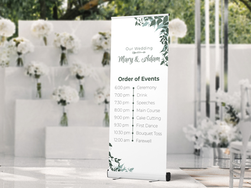 Elegant wedding roll-up banner showing the order of events for Mary and Adam’s ceremony with floral decorations.